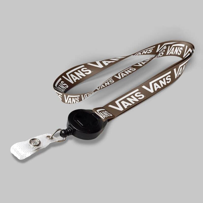1" Brown custom lanyard printed with company logo with Black Badge Reel attachment 1"