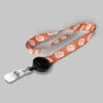 1" Light Orange custom lanyard printed with company logo with Black Badge Reel attachment 1"
