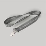 1" Charcoal custom lanyard printed with company logo with Bulldog Clip attachment 1"