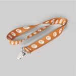 1" Light Orange custom lanyard printed with company logo with Bulldog Clip attachment 1"